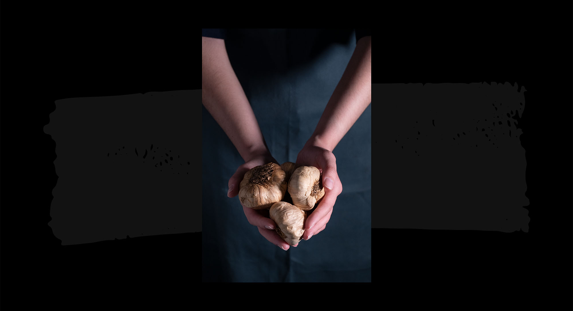 black-garlic-hands-back